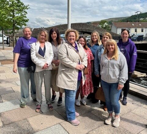 A group of people smiling at the camera