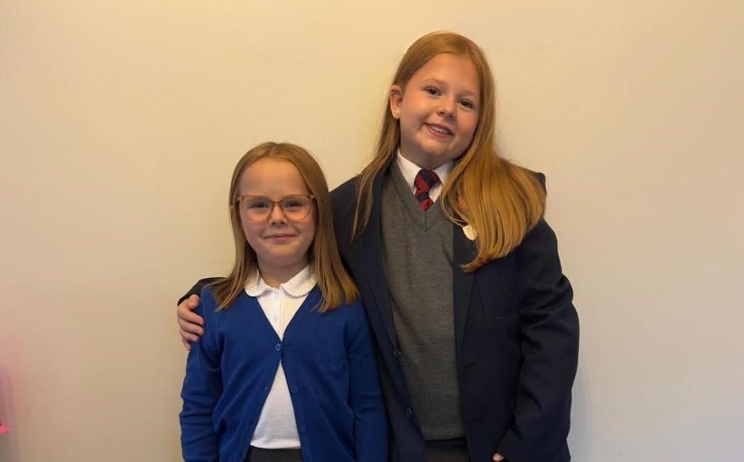 Two smiling children who are part of a foster family in RCT