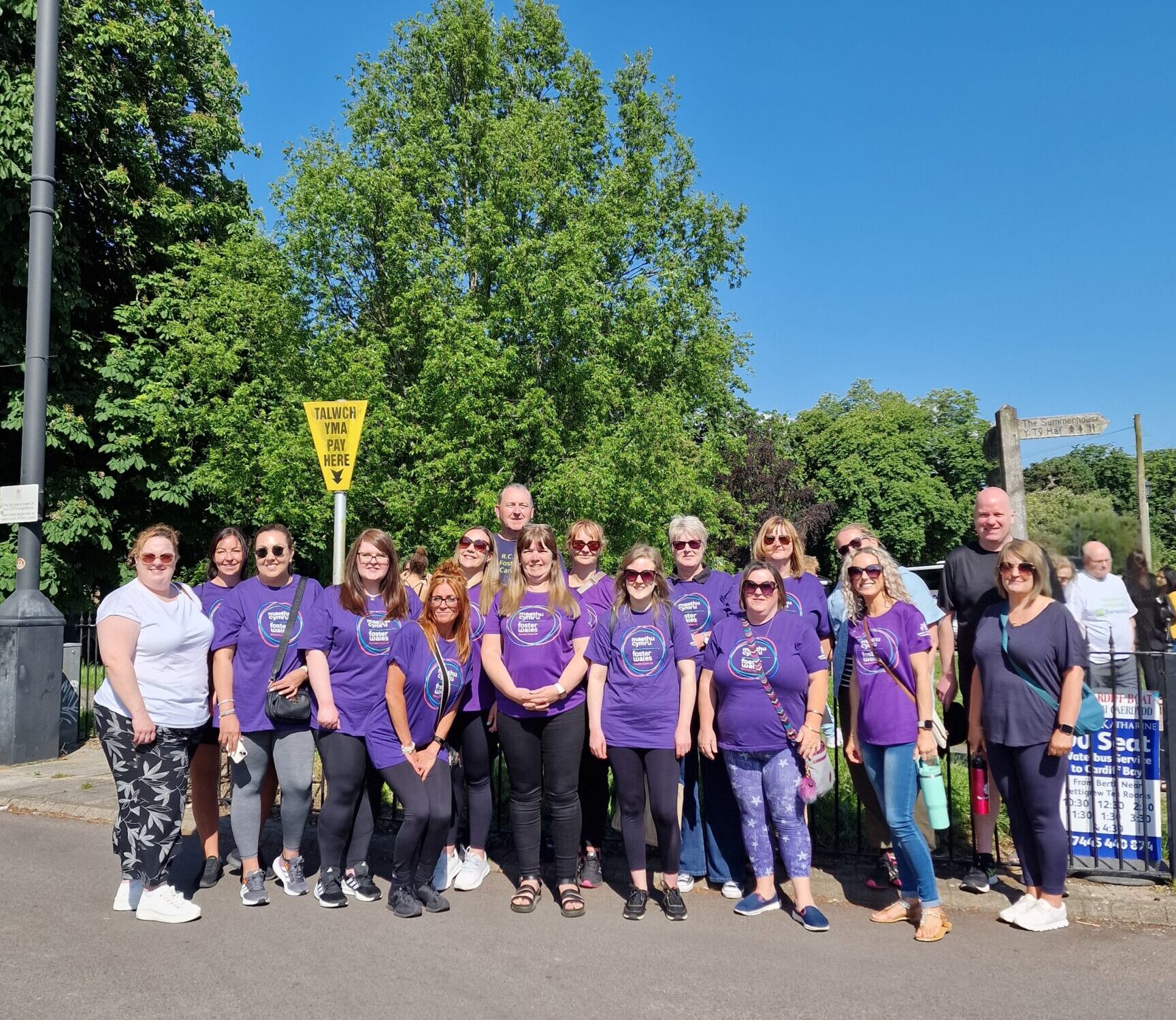 A group of RCT foster carers in their purple foster wales tshirts